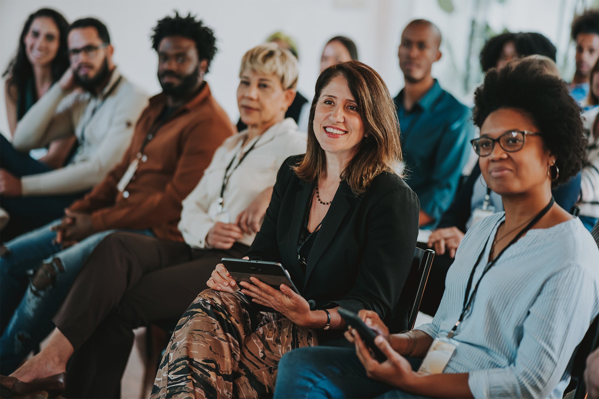 Group of people sitting together at a conference or meeting.
